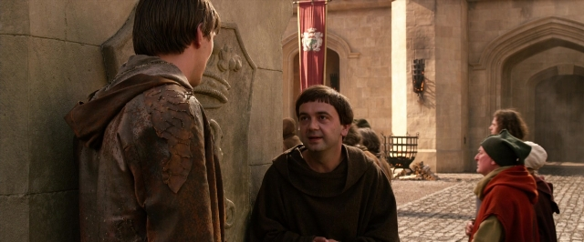 Wide shot frame from Jack the Giant Slayer — standing, dialogue, hat