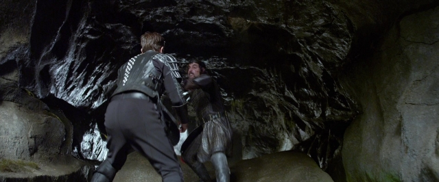 Wide shot frame from Jack the Giant Slayer — hand, face, fight