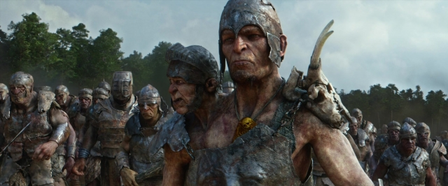 Wide shot frame from Jack the Giant Slayer — standing, hat, hand