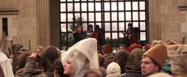 Wide shot frame from Jack the Giant Slayer — standing, suit, person