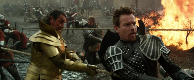 Wide shot frame from Jack the Giant Slayer — standing, fire, hand