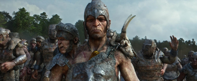 Medium shot frame from Jack the Giant Slayer — standing, hat, hand