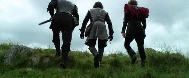 Wide shot frame from Jack the Giant Slayer — walking, hat, person