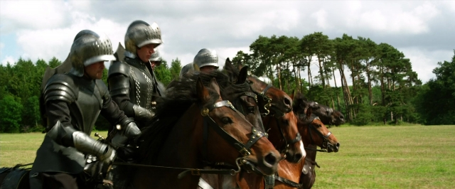 Wide shot frame from Jack the Giant Slayer — walking, horse, train