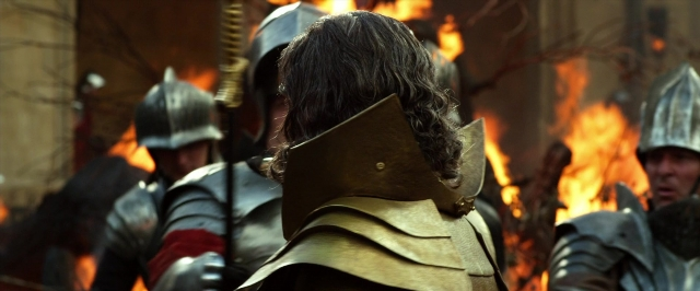 Wide shot frame from Jack the Giant Slayer — fire, hair, person