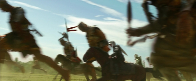 Wide shot frame from Jack the Giant Slayer — hat, hand, horse