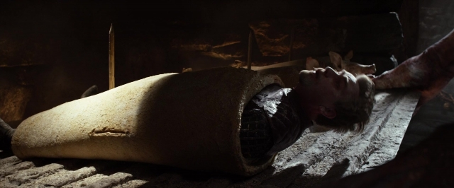 Wide shot frame from Jack the Giant Slayer — room, knife, person