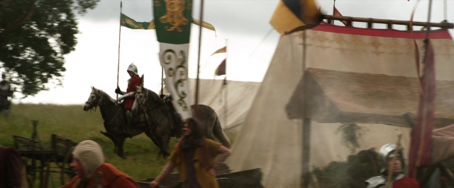 Wide shot frame from Jack the Giant Slayer — flag, horse, person