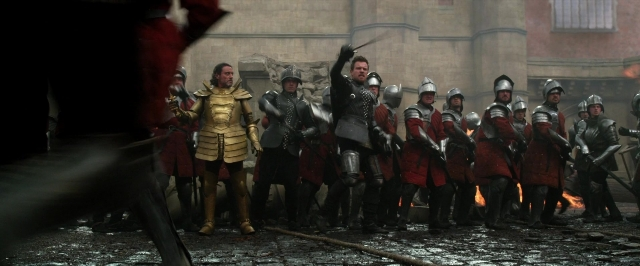 Wide shot frame from Jack the Giant Slayer — standing, fire, person