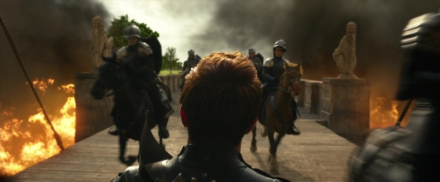 Wide shot frame from Jack the Giant Slayer — fire, hair, smoke