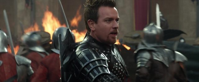 Medium shot frame from Jack the Giant Slayer — standing, dialogue, fire