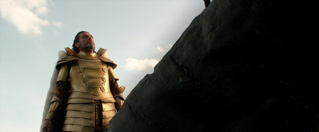 Wide shot frame from Jack the Giant Slayer — standing, suit, beard