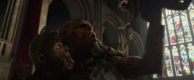 Wide shot frame from Jack the Giant Slayer — standing, hat, hand