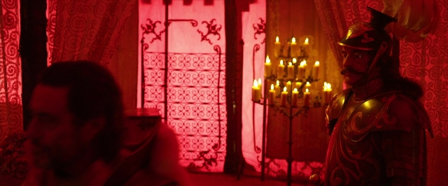 Wide shot frame from Jack the Giant Slayer — sitting, standing, room
