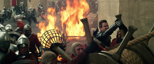 Wide shot frame from Jack the Giant Slayer — standing, fire, person