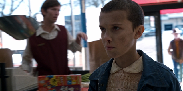 Medium shot frame from Stranger Things — standing, walking, shirt