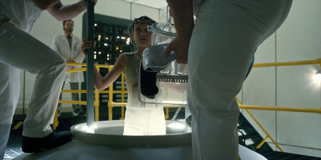Wide shot frame from Stranger Things — standing, hat, dress