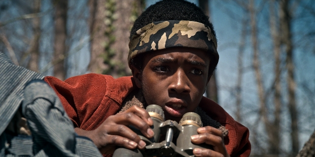 Wide shot frame from Stranger Things — face, person, human face