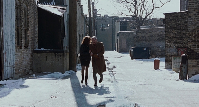 Wide shot frame from The Color of Money — walking, street, coat