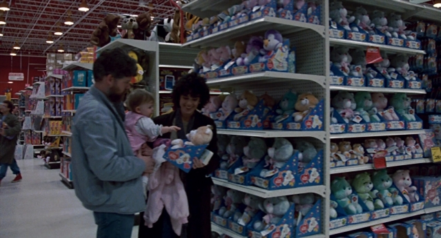 Wide shot frame from The Color of Money — dog, dress, shelf