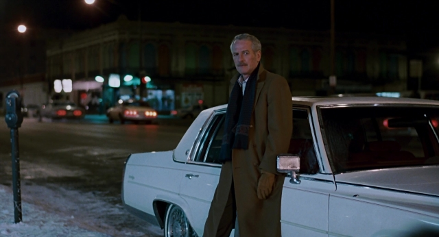 Wide shot frame from The Color of Money — standing, street, car
