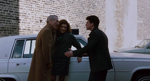 Wide shot frame from The Color of Money — standing, dialogue, car