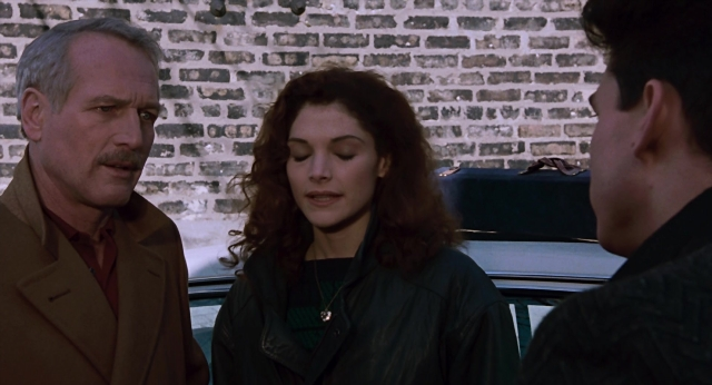 Wide shot frame from The Color of Money — standing, car, coat