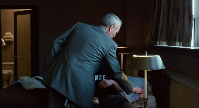 Wide shot frame from The Color of Money — standing, room, table
