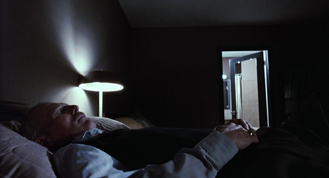 Frame from The Color of Money — room, bed, door
