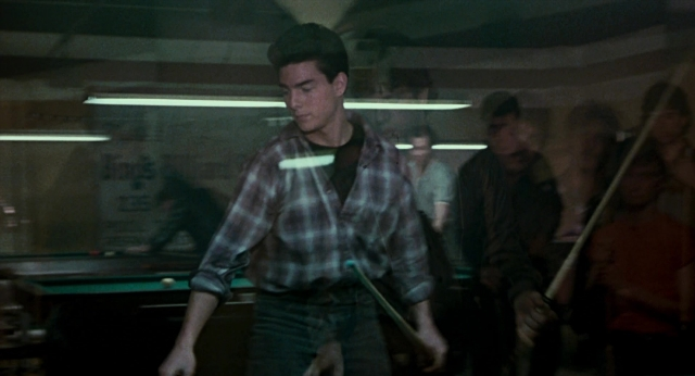 Wide shot frame from The Color of Money — room, table, hand