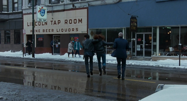 Wide shot frame from The Color of Money — walking, room, street