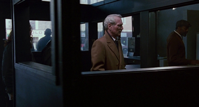 Frame from The Color of Money — standing, phone, suit