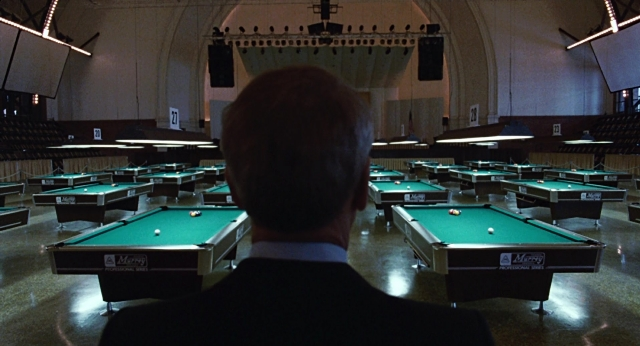 Frame from The Color of Money — standing, room, suit