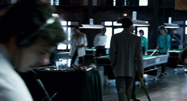 Medium shot frame from The Color of Money — room, table, hat