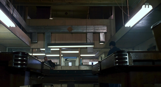 Wide shot frame from The Color of Money — standing, room, person