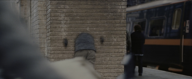 Wide shot frame from Harry Potter and the Sorcerer's Stone — standing, walking, street