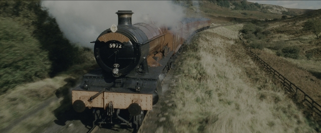 Wide shot frame from Harry Potter and the Sorcerer's Stone — train, smoke