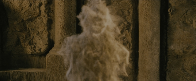 Wide shot frame from Harry Potter and the Sorcerer's Stone — smoke, statue sculpture