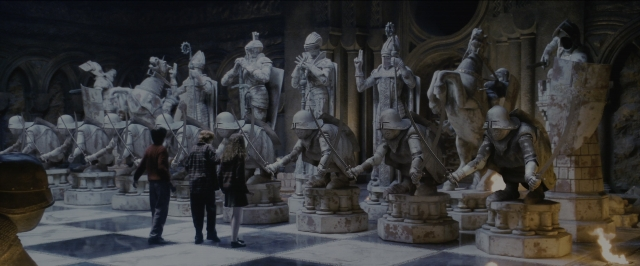 Wide shot frame from Harry Potter and the Sorcerer's Stone — standing, room, person