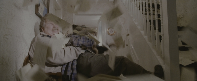Wide shot frame from Harry Potter and the Sorcerer's Stone — room, bed, clock