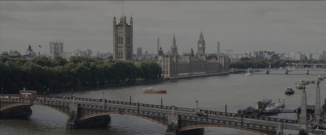 Wide shot frame from Harry Potter and the Sorcerer's Stone — walking, water, tower