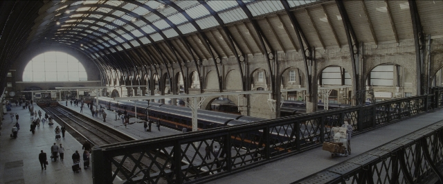 Wide shot frame from Harry Potter and the Sorcerer's Stone — train, person, window