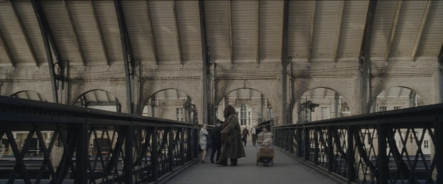 Wide shot frame from Harry Potter and the Sorcerer's Stone — walking, train, person