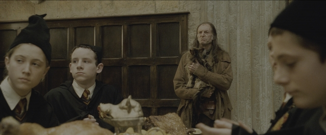 Wide shot frame from Harry Potter and the Sorcerer's Stone — sitting, standing, plate
