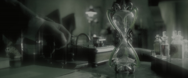 Wide shot frame from Harry Potter and the Half-Blood Prince — book, room, hand