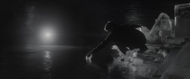 Wide shot frame from Harry Potter and the Half-Blood Prince — night, water, person