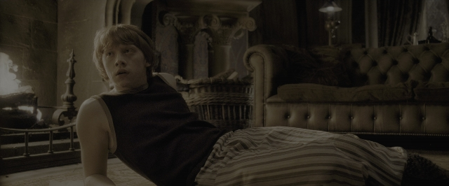 Wide shot frame from Harry Potter and the Half-Blood Prince — room, shirt, couch