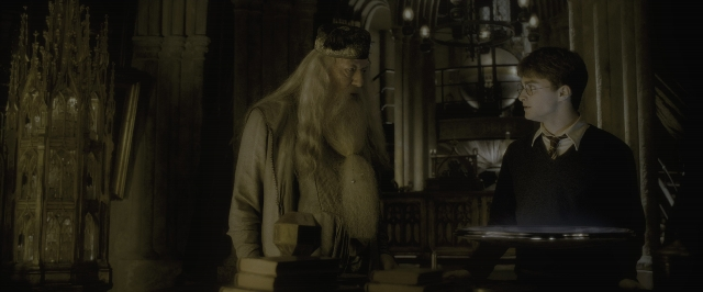 Wide shot frame from Harry Potter and the Half-Blood Prince — standing, room, dialogue