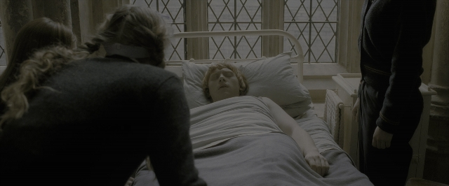 Wide shot frame from Harry Potter and the Half-Blood Prince — standing, room, bed