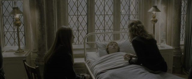 Wide shot frame from Harry Potter and the Half-Blood Prince — sitting, room, bed